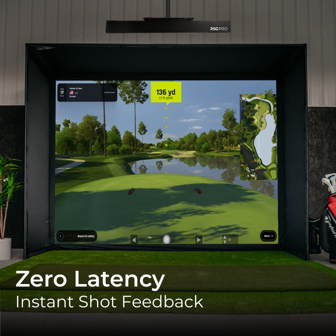 Golf simulator setup with screen displaying a golf course, surrounded by golf clubs and equipment.