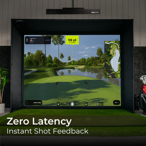 Golf simulator setup with screen displaying a golf course, surrounded by golf clubs and equipment.